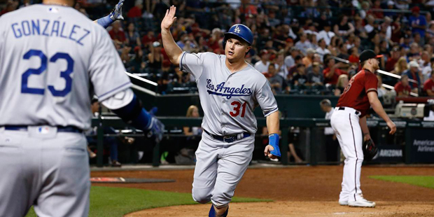 Los Angeles Dodgers' Joc Pederson (31) celebrates his run scored against the Arizona Diamondbacks w...