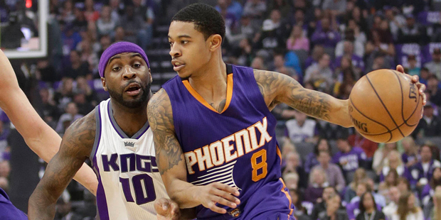 Phoenix Suns guard Tyler Ulis, right, drives against Sacramento Kings guard Ty Lawson during the fi...