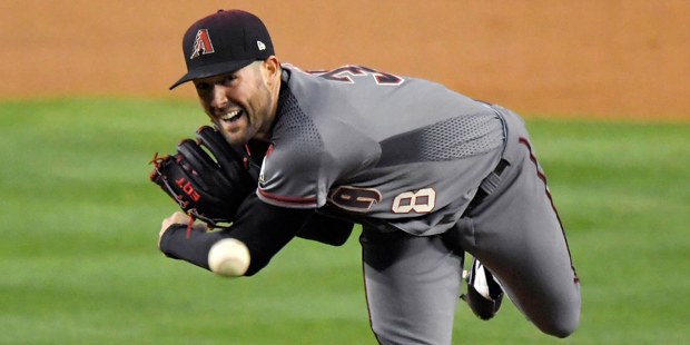 Arizona Diamondbacks starting pitcher Robbie Ray throws to the plate during the second inning of a ...