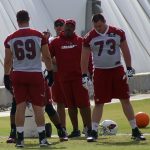 Offensive coordinator Harold Goodwin works with Will Holden and John Wetzel during Arizona Cardinals OTAs Tuesday, May 16. (Photo by Adam Green/Arizona Sports)
