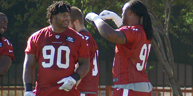 DL Robert Nkemdiche chats with Ed Stinson during an OTA practice May 24. (Photo by Adam Green/Arizo...