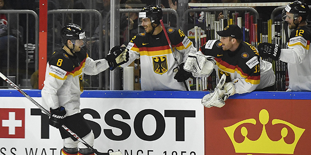 Germany's forward Tobias Rieder celebrates his goal with teammates on the bench during the Ice Hock...