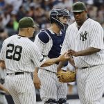 New York Yankees starting pitcher CC Sabathia, right, hands the ball to manager Joe Girardi (28) as he leaves the game during the seventh inning of a baseball game against the Oakland Athletics Saturday, May 27, 2017, in New York. (AP Photo/Frank Franklin II)