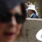 Fans arrive for the 143rd running of the Kentucky Derby horse race at Churchill Downs Saturday, May 6, 2017, in Louisville, Ky. (AP Photo/John Minchillo)