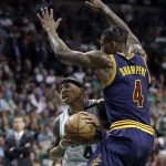 Boston Celtics guard Isaiah Thomas, left, drives into the defense of Cleveland Cavaliers guard Iman Shumpert (4) during first half of Game 2 of the NBA basketball Eastern Conference finals, Friday, May 19, 2017, in Boston. (AP Photo/Elise Amendola)
