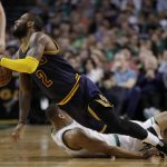 Cleveland Cavaliers guard Kyrie Irving (2) falls with Boston Celtics guard Avery Bradley (0) during the first half of Game 2 of the NBA basketball Eastern Conference finals, Friday, May 19, 2017, in Boston. (AP Photo/Elise Amendola)
