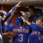 New York Mets' Curtis Granderson (3) celebrates his home run against the Arizona Diamondbacks with teammates in the dugout, including Lucas Duda (21), during the fifth inning of a baseball game, Tuesday, May 16, 2017, in Phoenix. (AP Photo/Ross D. Franklin)