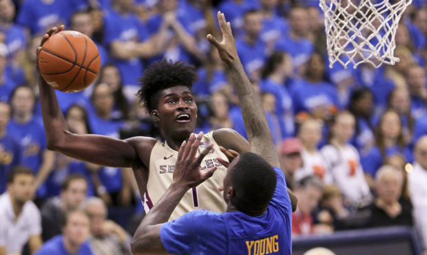 Florida State's Jonathan Isaac (1) shoots over Pittsburgh's Michael Young (2) during the second hal...