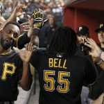 Pittsburgh Pirates' Josh Bell (55) celebrates his two-run home run against the Arizona Diamondbacks with teammates, including Andrew McCutchen, left, during the fourth inning of a baseball game Friday, May 12, 2017, in Phoenix. (AP Photo/Ross D. Franklin)