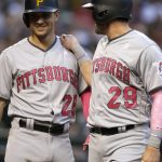 Pittsburgh Pirates Francisco Cervelli celebrates with Adam Frazier (26) after scoring a run during the sixth inning of the team's baseball game against the Arizona Diamondbacks, Saturday, May 13, 2017, in Phoenix. (AP Photo/Rick Scuteri)