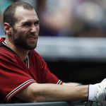 Arizona Diamondbacks' Paul Goldschmidt leans over the dugout rail as he waits to bat against Colorado Rockies starting pitcher Tyler Chatwood in the first inning of a baseball game Sunday, May 7, 2017, in Denver. (AP Photo/David Zalubowski)