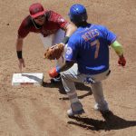 New York Mets Jose Reyes (7) is tagged out by Arizona Diamondbacks Brandon Drury while trying for a double during the second inning of a baseball game, Wednesday, May 17, 2017, in Phoenix. (AP Photo/Matt York)