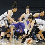 From left to right, San Antonio Stars' Nia Coffey Phoenix Mercury's Yvonne Turner, and  Stars' Monique Currie grab for the ball during first-half WNBA basketball game action Friday, May 19, 2017, in San Antonio. (Edward A. Ornelas/The San Antonio Express-News via AP)