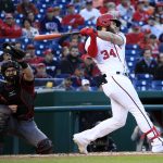 Washington Nationals Bryce Harper (34) swings and misses as Arizona Diamondbacks catcher Jeff Mathis (2) catches the ball for a strike out during the first inning of a baseball game in Washington, Wednesday, May 3, 2017. (AP Photo/Manuel Balce Ceneta)