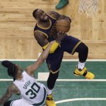 Cleveland Cavaliers forward LeBron James (23) drives against Boston Celtics forward Gerald Green (30) hanging on during first half of Game 2 of the NBA basketball Eastern Conference finals, Friday, May 19, 2017, in Boston. (AP Photo/Elise Amendola)