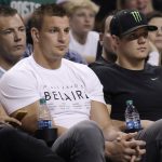 New England Patriots tight end Rob Gronkowski, left, watches the second half of Game 2 of the NBA basketball Eastern Conference finals between the Boston Celtics and the Cleveland Cavaliers, Friday, May 19, 2017, in Boston. (AP Photo/Elise Amendola)