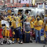 Nashville Predators fans watch the Predators play the Pittsburgh Penguins in Game 1 of the NHL Stanley Cup Finals at a viewing area set up outside Bridgestone Arena, Monday, May 29, 2017, in Nashville, Tenn. (AP Photo/Mark Humphrey)