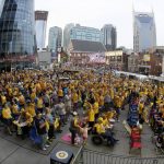 Nashville Predators fans watch the Predators play the Pittsburgh Penguins in Game 1 of the NHL hockey Stanley Cup Finals at a viewing area set up in front of Bridgestone Arena Monday, May 29, 2017, in Nashville, Tenn. (AP Photo/Mark Humphrey)