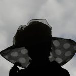A woman wears a fancy hat before the 143rd running of the Kentucky Derby horse race at Churchill Downs Saturday, May 6, 2017, in Louisville, Ky. (AP Photo/Charlie Riedel)