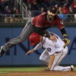 Arizona Diamondbacks second baseman Daniel Descalso (3) leaps over Washington Nationals Trea Turner (7) after throwing to first to complete a double play during the eighth inning of a baseball game in Washington, Wednesday, May 3, 2017. The Nationals won 3-2. (AP Photo/Manuel Balce Ceneta)