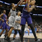 San Antonio Stars' Monique Currie and Phoenix Mercury's Brittney Griner, right, grab for a rebound during first-half WNBA basketball game action Friday, May 19, 2017, in San Antonio. (Edward A. Ornelas/The San Antonio Express-News via AP)  AP)
