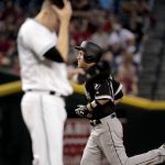Chicago White Sox Todd Frazier (21) rounds the bases as Arizona Diamondbacks starting pitcher Patrick Corbin (46) looks down after hitting a two-run home run against during the third inning of a baseball game, Tuesday, May 23, 2017, in Phoenix. (AP Photo/Matt York)