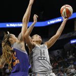 San Antonio Stars' Erika de Souza shoots around Phoenix Mercury's Brittney Griner during second-half WNBA basketball game action Friday, May 19, 2017, in San Antonio. (Edward A. Ornelas/The San Antonio Express-News via AP)