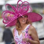 Stephanie Hirn, of Alexandria Va., walks in the grandstand area ahead of the running of the Preakness Stakes horse race at Pimlico race course, Saturday, May 20, 2017, in Baltimore. The 142nd Preakness Stakes horse race runs Saturday. (AP Photo/Nick Wass)