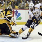 Nashville Predators' Craig Smith (15) tries to jab the puck past Pittsburgh Penguins' goalie Matt Murray (30) during the first period Game 1 of the NHL hockey Stanley Cup Final, Monday, May 29, 2017, in Pittsburgh. (AP Photo/Keith Srakocic)