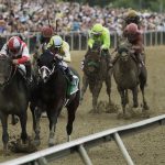 Cloud Computing (2), ridden by Javier Castellano, second from left, wins142nd Preakness Stakes horse race at Pimlico race course as Classic Empire (5) with Julien Leparoux aboard takes second, Saturday, May 20, 2017, in Baltimore. (AP Photo/Matt Slocum)
