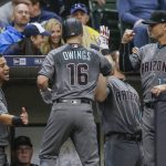 Arizona Diamondbacks' Chris Owings is greeted by teammates after hitting a solo home run off of Milwaukee Brewers' Zach Davies during the second inning of a baseball game Thursday, May 25, 2017, in Milwaukee. (AP Photo/Tom Lynn)