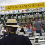 Gleb Taran, of Vienna, Va., watches the action ahead of the running of the 142nd Preakness Stakes horse race at Pimlico race course, Saturday, May 20, 2017, in Baltimore. (AP Photo/Patrick Semansky)