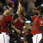 Arizona Diamondbacks' Fernando Rodney (56) gives a high-five to catcher Chris Iannetta, left, after the final out in the ninth inning of a baseball game against the Chicago White Sox Wednesday, May 24, 2017, in Phoenix. The Diamondbacks defeated the White Sox 8-6. (AP Photo/Ross D. Franklin)