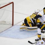 Nashville Predators' Frederick Gaudreau, right, watches his goal against Pittsburgh Penguins' goalie Matt Murray (30) during the third period in Game 1 of the NHL hockey Stanley Cup Finals, Monday, May 29, 2017, in Pittsburgh. (AP Photo/Gene J. Puskar)