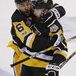 Pittsburgh Penguins' Nick Bonino, right, celebrates his empty-net goal against the Nashville Predators with Trevor Daley, left, during the third period in Game 1 of the NHL hockey Stanley Cup Finals, Monday, May 29, 2017, in Pittsburgh. (AP Photo/Gene J. Puskar)