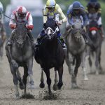 Cloud Computing, left, ridden by Javier Castellano, second from left, wins142nd Preakness Stakes horse race at Pimlico race course as Classic Empire (5) with Julien Leparoux aboard takes second, Saturday, May 20, 2017, in Baltimore. (AP Photo/Patrick Semansky)