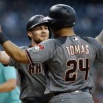 Arizona Diamondbacks' Yasmany Tomas, right, congratulates Brandon Drury at the plate for Drury's two-run home run against the San Diego Padres during the first inning of a baseball game in San Diego, Friday, May 19, 2017. (AP Photo/Alex Gallardo)