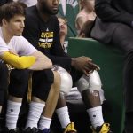 Cleveland Cavaliers' Kyle Korver, left, and LeBron James, right, with ice on his knees, watch from the bench during the second half of Game 2 of the NBA basketball Eastern Conference finals, against the Boston Celtics, Friday, May 19, 2017, in Boston. (AP Photo/Elise Amendola)