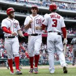 Washington Nationals' Bryce Harper, left, and Ryan Zimmerman are congratulated by teammate Michael Taylor (3) as they score on Anthony Rendon's two-run double, during the third inning of a baseball game against the Arizona Diamondbacks in Washington, Thursday, May 4, 2017. (AP Photo/Manuel Balce Ceneta)