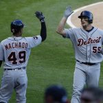 Detroit Tigers' John Hicks, right, celebrates with Dixon Machado after hitting a solo home run against the Chicago White Sox in the fourth inning of the second game of a baseball doubleheader, Saturday, May 27, 2017, in Chicago. (AP Photo/Nam Y. Huh)