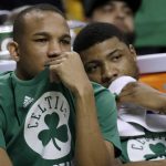Boston Celtics guards Avery Bradley, left, and Marcus Smart watch from the bench during the second half of Game 2 of the NBA basketball Eastern Conference finals against the Cleveland Cavaliers, Friday, May 19, 2017, in Boston. (AP Photo/Elise Amendola)