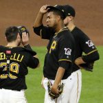Pittsburgh Pirates starting pitcher Ivan Nova, center, waits for a visit from pitching coach Ray Searage with catcher Francisco Cervelli (29) and shortstop Jordy Mercer, rear, in the seventh inning of a baseball game against the Arizona Diamondbacks in Pittsburgh, Tuesday, May 30, 2017. (AP Photo/Gene J. Puskar)