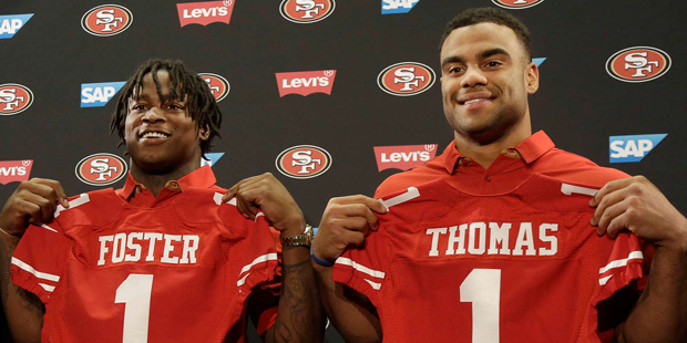 San Francisco 49ers draft picks Reuben Foster, left, and Solomon Thomas pose for photos at a news c...