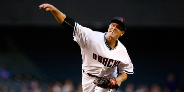 Arizona Diamondbacks' Zack Greinke throws a pitch against the New York Mets during the first inning...