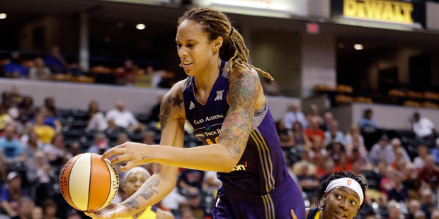 Phoenix Mercury's Brittney Griner (42) is fouled by Indiana Fever's Erica Wheeler (17) during the s...