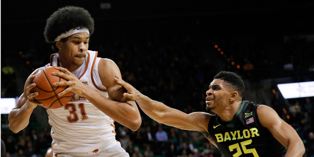 Texas forward Jarrett Allen (31) comes down with an offensive rebound in front of Baylor's Al Freem...