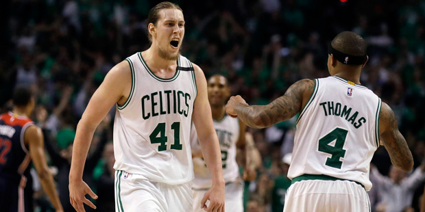 Boston Celtics center Kelly Olynyk (41) celebrates his basket with guard Isaiah Thomas (4) during t...