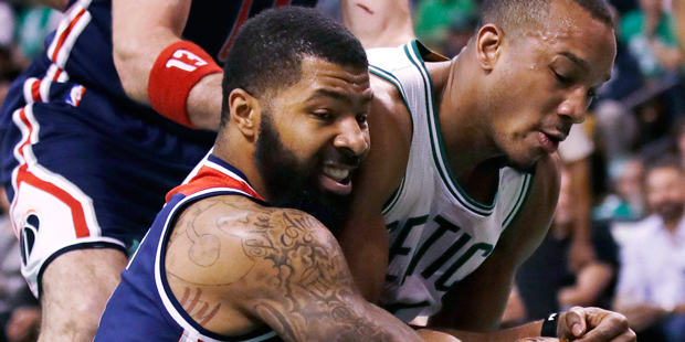 Boston Celtics guard Avery Bradley, right, and Washington Wizards forward Markieff Morris, left, wr...
