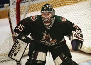 Phoenix Coyotes goalie Nikolai Khabibulin, shown in this April 22, 1998 file photo, eyeballs game action against the Detroit Red Wings. Khabibulin, who has a history of tormenting the Red Wings at playoff time, left Game 4 midway through the second period with an apparent injury. But that can be misleading. Teams in the NHL almost always fib about injuries. (AP Photo/Carlos Osorio)
