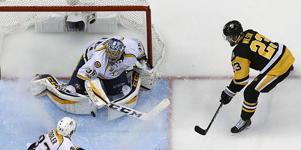 Pittsburgh Penguins' Scott Wilson (23) shoots against Nashville Predators goalie Pekka Rinne with V...